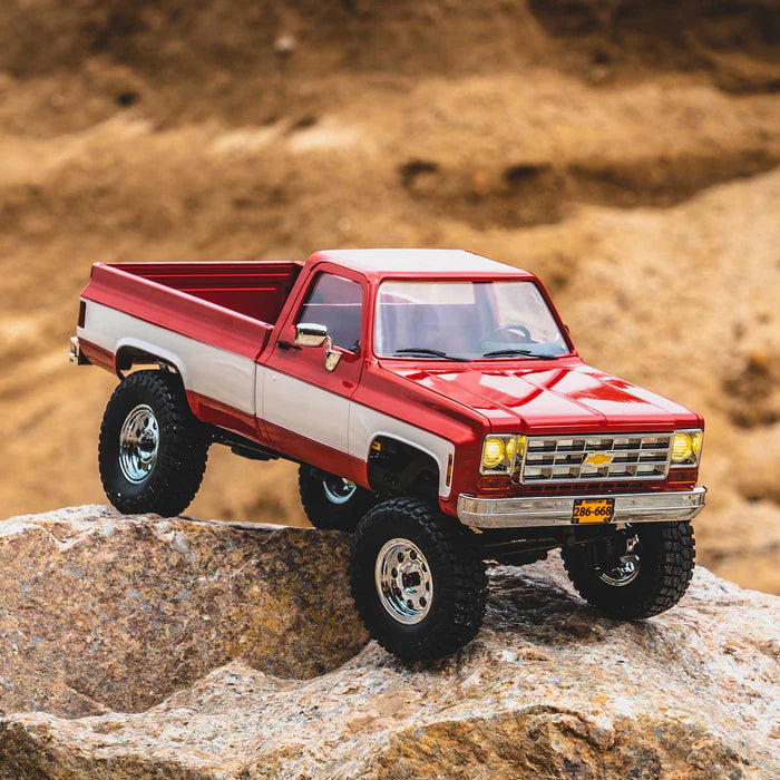 FMS FCX18 Chevrolet K10 1/18 scale RC crawler climbing rocky terrain