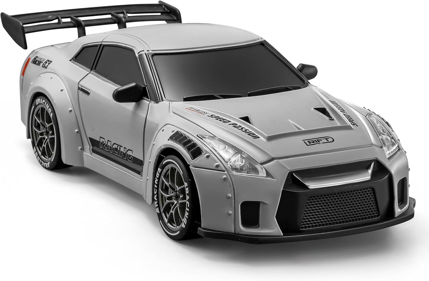 ACAMMZAR 1/24 RC mini drift car Nissan GT-R inspired - front three-quarter view in metallic blue body with LED headlights lit, detailed grille, wide fenders, drift tires, and compact 4WD chassis
