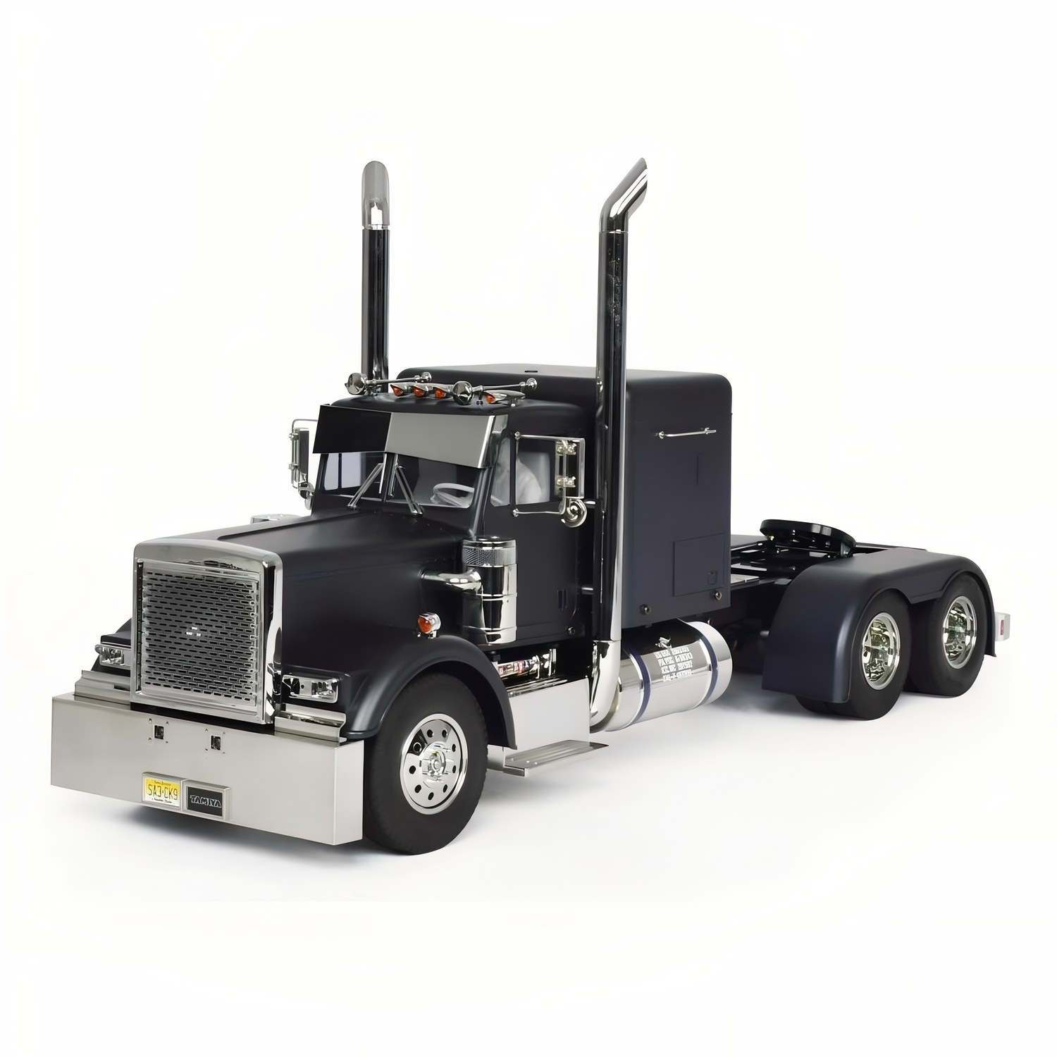 Tamiya 1/14 Grand Hauler Matte Black Edition kit – front 3/4 view in matte black body showing boxy cab, chrome air cleaners/mirrors, detailed grille, bumper, ladder frame hints