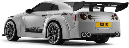 ACAMMZAR 1/24 Nissan GT-R inspired RC drift car - rear three-quarter view in grey body showing rear spoiler, LED taillights, diffuser, wide fenders, and compact drift chassis