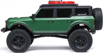 Side profile of Axial SCX24 Ford Bronco 4WD RC mini rock crawler showing body and wheel stance