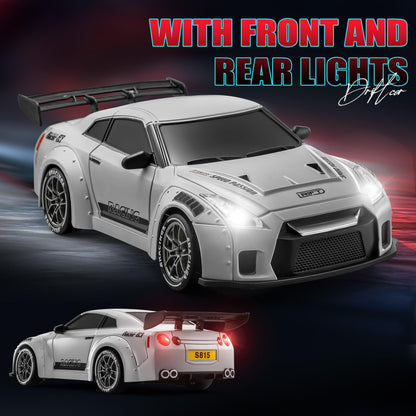White ACAMMZAR 1/24 GT-R RC mini drift car with front and rear lights on a dark background