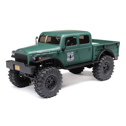 Axial SCX24 Dodge Power Wagon 1/24 4WD RTR mini rock crawler – front 3/4 view in green body showing classic grille, headlights, beadlock wheels, soft tires