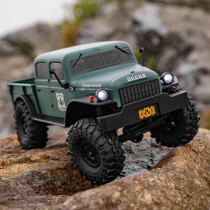 Axial 1/24 SCX24 Dodge – side action on rocks, body moving, shocks compressing
