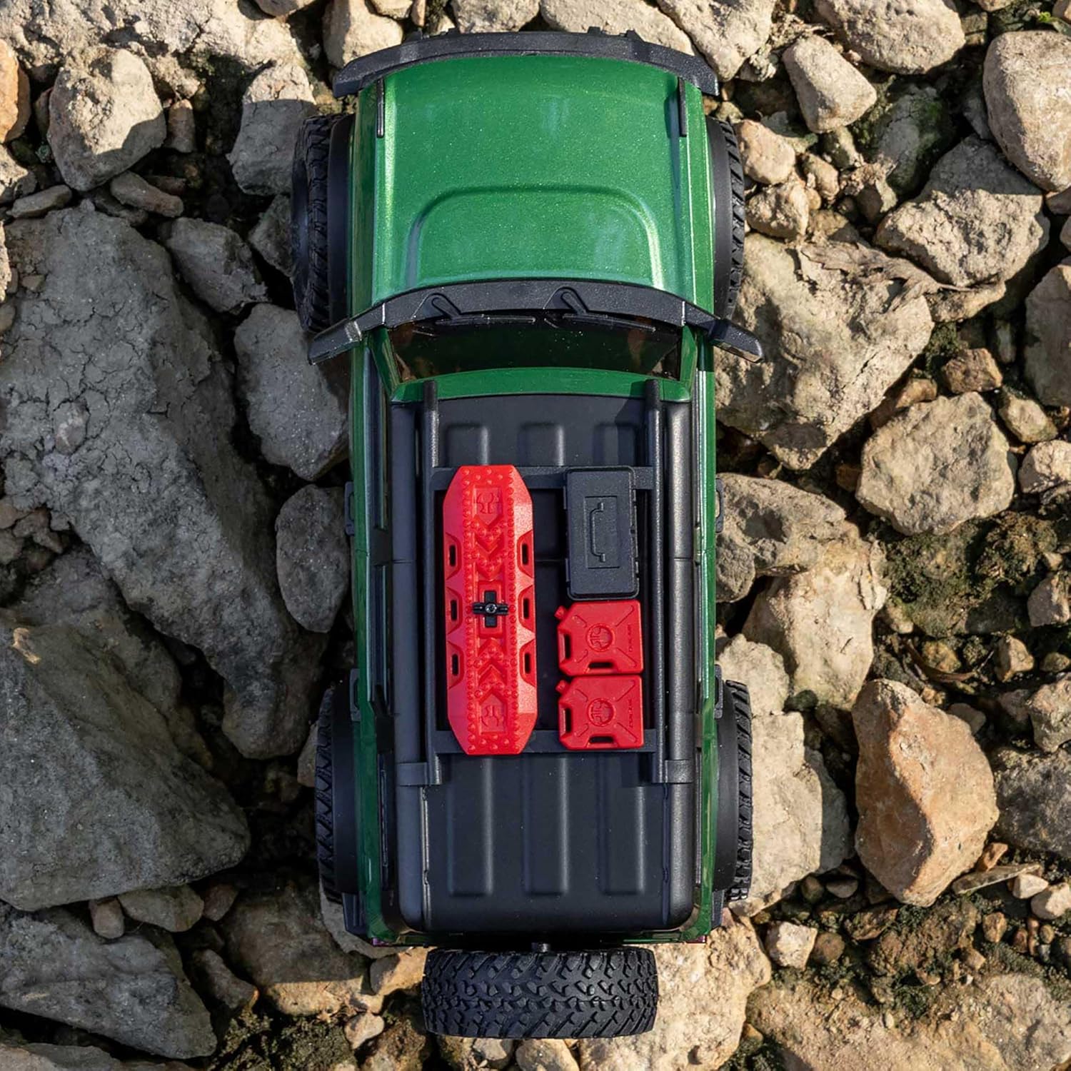 Top view of Axial SCX24 Ford Bronco scale RC crawler showing roof and body lines on a rocky surface