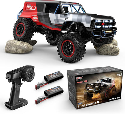 MJX Hyper Go H12P RC crawler front three-quarter view with remote control, batteries, and packaging