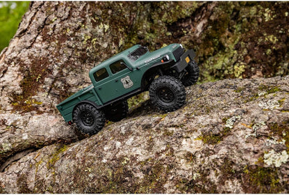 Axial SCX24 Power Wagon 1/24 crawler climbing – green body tilt, suspension flex, tire grip on rocks