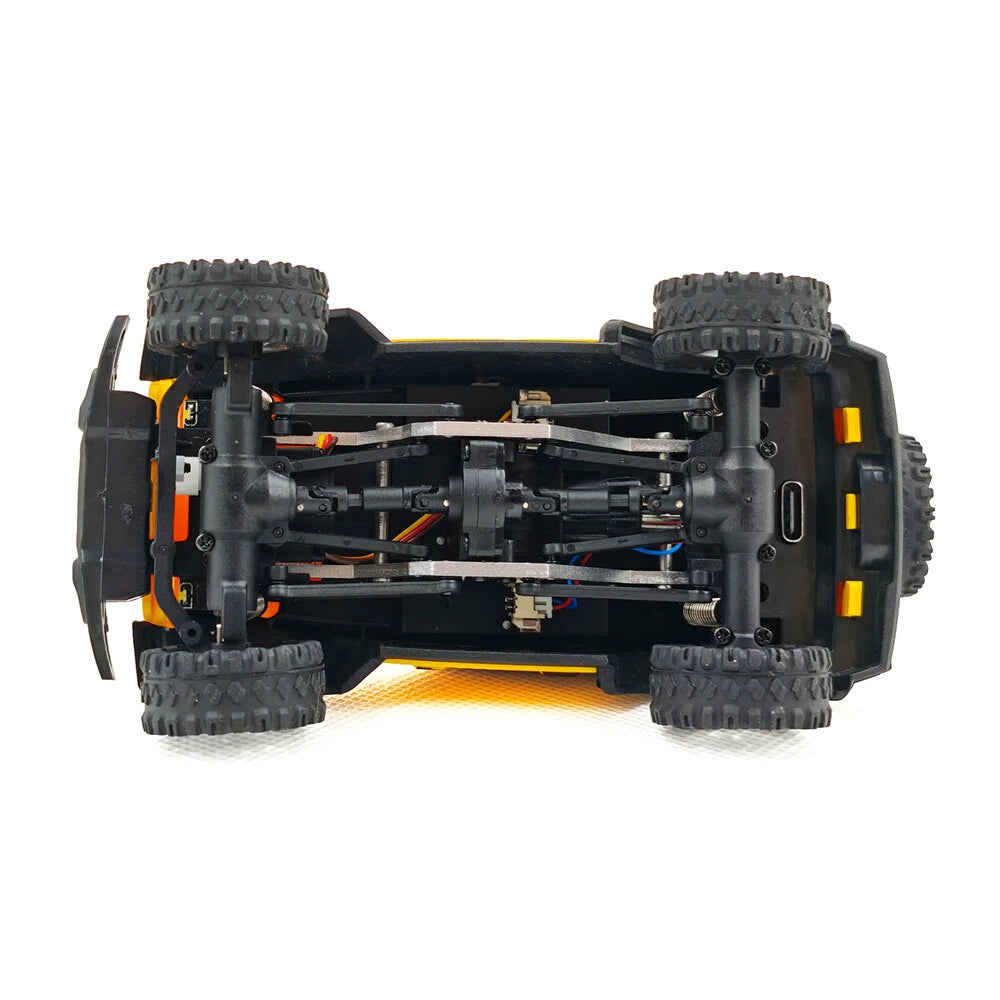JIABAILE 3601/3602 1/36 scale 4WD RTR RC rock crawler – bottom view of toy car with visible mechanical components and charging port, portal axles, drivetrain, and compact chassis