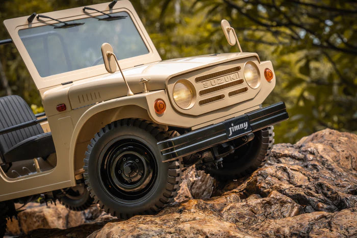 1/6 scale Suzuki Jimny 4WD RTR off-road truck climbing rocky terrain